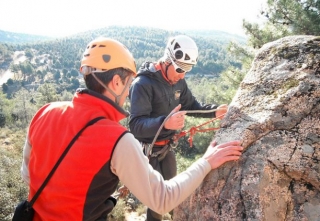  a couple of friends preparing to climb